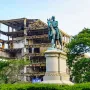 Winfield Scott equestrian statue in front of a partially demolished building.