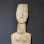 Kykladic Idol marble female figurine with folded arms and elongated head