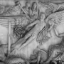 Relief on the Antoninus Pius Column showing a winged figure rising between eagles, surrounded by draped and seated classical figures.
