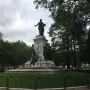 The Marquis de Lafayette statue, a large bronze monument with figures on a stone pedestal in a fenced park.