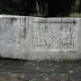 Keys Handover Memorial stone monument with a relief of historical figures and Cyrillic inscription