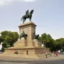 Giuseppe Garibaldi equestrian statue on a large stone pedestal in a public square