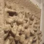 Battle of the Centaurs marble relief showing a dense struggle of nude, muscular figures