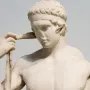 Farnese Diadumenos marble sculpture shown in close-up, with the athletic figure adjusting a band around his head