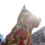 Puppy, a giant dog sculpture covered in colorful flowers, standing outdoors near the Guggenheim Museum Bilbao.