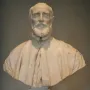 Francesco Barberini bust in white marble, shown with a full beard, mustache, and draped cloak on an ornate pedestal.