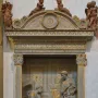 Donatello\'s Cavalcanti Annunciation relief showing an angel kneeling before a standing woman beneath an ornate arched frame.