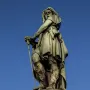 The Vercingetorix Monument, a green-patinated bronze warrior statue on a tall stone pedestal.