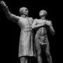 Victor Schœlcher statue showing two male figures, one in a coat with an arm raised and another bare-chested with shackles at his feet.