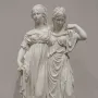 Princesses Monument showing two white classical women in flowing gowns standing together on a base.