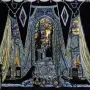 Gothic stage design for The Stone Guest with draped curtains, a glowing stained-glass archway, and ceremonial objects in the foreground.