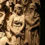 Carved relief on the Portonaccio Sarcophagus showing a draped woman and bearded man among other figures.