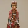Virgin from Ger, a painted wooden Madonna and Child sculpture with faded red and yellow pigments.
