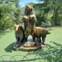Group of Bears sculpture with a tall bear flanked by two smaller bears on a stepped base.