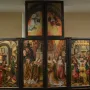 Fisenne Altarpiece with six painted panels in a dark wooden frame