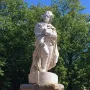 George Washington marble statue in military attire standing on a pedestal