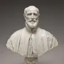Francesco Barberini bust in white marble, shown with a full beard, mustache, and draped cloak on an ornate pedestal.