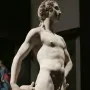 Apollo and Hyacinth in white marble, showing a standing figure beside a kneeling figure looking upward.