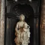 Madonna of Bruges marble sculpture of a seated woman holding a nude infant in an ornate niche