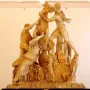 The Farnese Bull marble sculpture showing a dramatic scene with two men struggling to subdue a bull and a female figure beneath it.