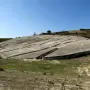 Il Grande Cretto stretching across a hillside in a pattern of light concrete blocks and dark fissures.