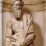 Marble statue of Saint Paul in a niche on the Piccolomini Altar in Siena Cathedral, holding a book and a downward-pointing sword.