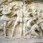Marble relief from Giovanni delle Bande Nere monument showing classical figures in struggle and supplication.