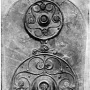 Battersea Shield with three ornate circular bosses and intricate metalwork along its length.