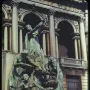 Fountain of the Great Lakes with bronze draped figures surrounding a cascading water vessel.