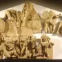 Talamone Pediment terracotta relief with warriors, horses, and chariots in a battle scene