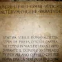 Stone slabs beneath the Scior Carera with Latin and Italian engraved inscriptions.