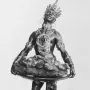 Moor with Emerald Plate sculpture showing a crowned figure with ornate jewelry holding a large tray above a rock-like base.