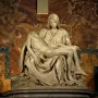 Michelangelo’s Pietà, a white marble sculpture of the Virgin Mary holding the body of Christ.