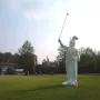 Hermannsdenkmal statue of a warrior holding a golf club on a manicured lawn.