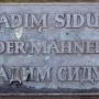 Bronze plaque for Der Mahner by Vadim Sidur with raised Latin and Cyrillic lettering.