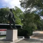 General José Gervasio Artigas statue holding a hat on a stone pedestal.