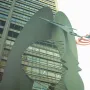 The Picasso sculpture in Chicago framed against the Richard J. Daley Center, with an American flag visible above.