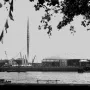 The Skylon, a tall slender pointed framework structure, rises against a bright sky.
