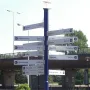 Madurodam signpost with directional signs to cities around the world