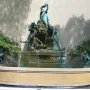 Fountain of the Great Lakes with bronze draped figures surrounding a cascading water vessel.