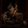 Saint George and the Dragon sculpture showing a knight in gilded armor on a rearing horse over a defeated dragon.