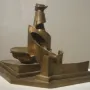 Development of a Bottle in Space, a bronze abstract sculpture with fragmented curved and angular forms on a stepped rectangular base.