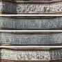 Four stacked panoramic panels showing the Frieze of Parnassus with detailed bas-relief figures in different directions.