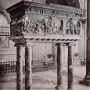 The Resurrection Pulpit by Donatello, a bronze pulpit with detailed relief scenes on four marble columns inside a church.
