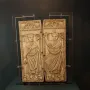 Diptych of Boethius with two carved ivory panels showing robed male figures holding staffs.