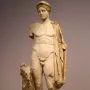 Hermes Criophorus marble statue of a youthful nude figure beside a ram, with a cap and drapery over one shoulder.