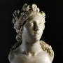 Blessed Soul marble bust of a woman with an upward gaze and curled hair