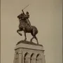 Joan of Arc equestrian statue with an armored rider holding a flag aloft.