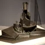 Development of a Bottle in Space, a bronze abstract sculpture with fragmented curved and angular forms on a stepped rectangular base.