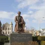 Seated bronze Abraham Lincoln statue on a granite pedestal inscribed with Lincoln\'s quote.